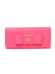 High Quality Imitation Prada Saffiano Leather Wallet with Leather Bow 1M1132B Rosy Tl6751Vu82